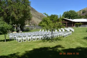 White chairs setup for a wedding on the Salmon River